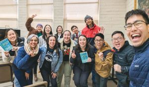 Young SGI-USA members in Oakland taking a group photo after their Ikeda Wisdom Academy meeting.